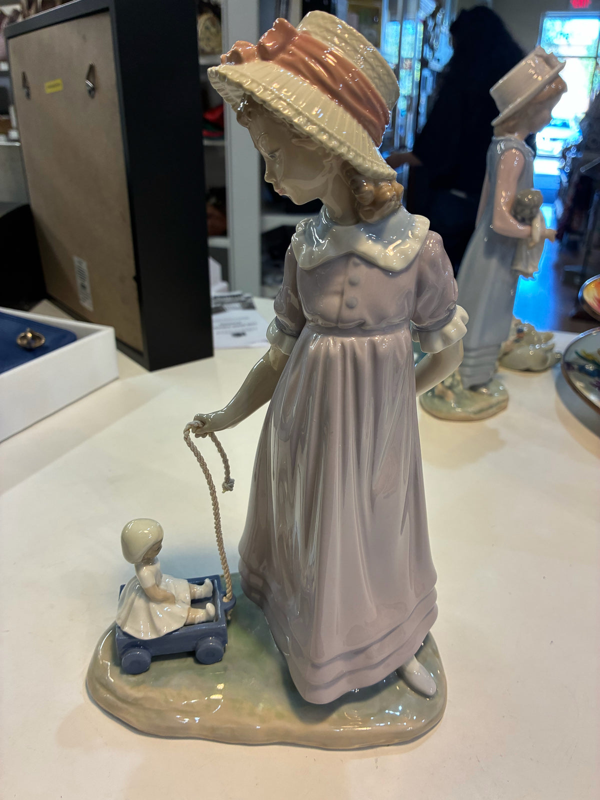 Lladro #5044 "Girl with Toy Wagon/Pulling Doll"