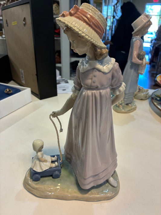 Lladro #5044 "Girl with Toy Wagon/Pulling Doll"