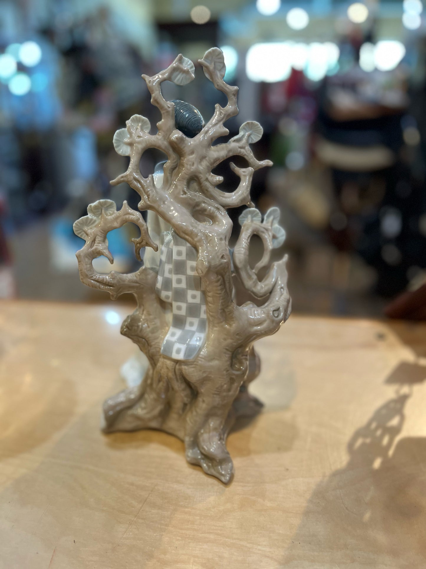 Retired Lladro "Geisha Seated on a Tree Stump" Figurine